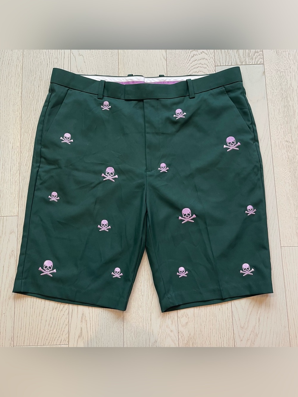 G/FORE Killer T’s pine green golf shorts with Pink Skull Crossbones Embroidery